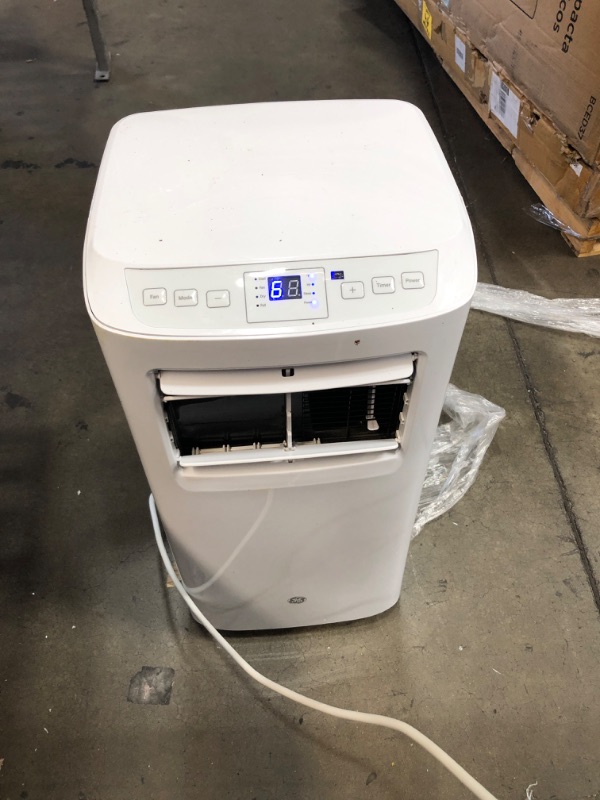 Photo 2 of APFD05JASW Portable Air Conditioner with 5100 BTU Cooling Capacity 115 Volts Auto Evaporation Technology and Digital Controls with Remote in
