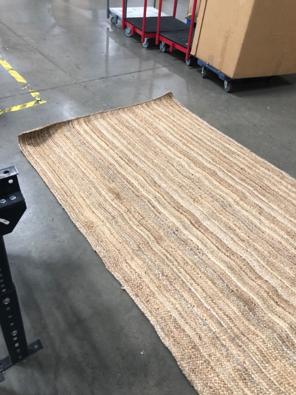 Photo 7 of **USED-NEEDS CLEANING**
60'INCH X 93'INCH WOVEN RUG 