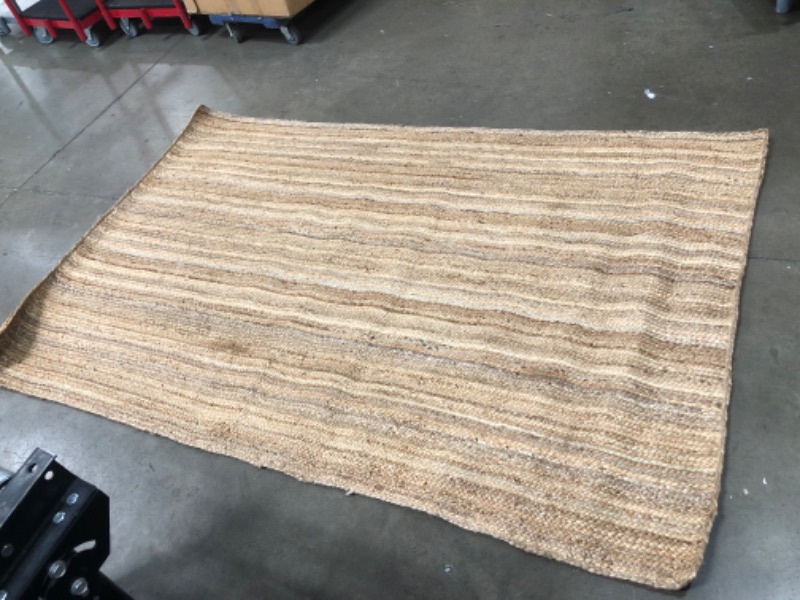 Photo 1 of **USED-NEEDS CLEANING**
60'INCH X 93'INCH WOVEN RUG 