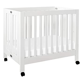 Photo 1 of Babyletto Origami Mini Portable Crib Folding with Wheels in White, 2 Adjustable Mattress Positions, Greenguard Gold Certified
