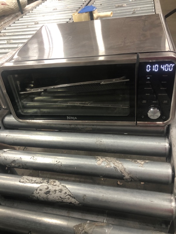 Photo 2 of Ninja SP201 Digital Air Fry Pro Countertop 8-in-1 Oven with Extended Height, XL Capacity, Flip Up & Away Capability for Storage Space, with Air Fry Basket, Wire Rack & Crumb Tray, Silver
