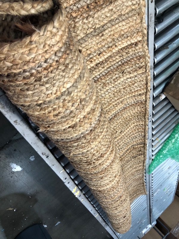 Photo 1 of **damaged-needs cleaning**
Rigo Chunky Loop Jute Tan 6 ft. x 9 ft. Area Rug
