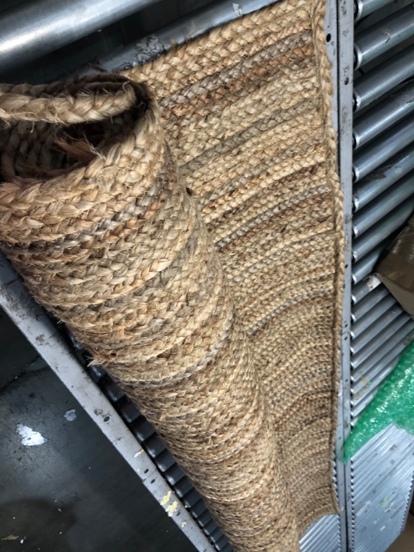 Photo 1 of **damaged-needs cleaning**
Rigo Chunky Loop Jute Tan 6 ft. x 9 ft. Area Rug
