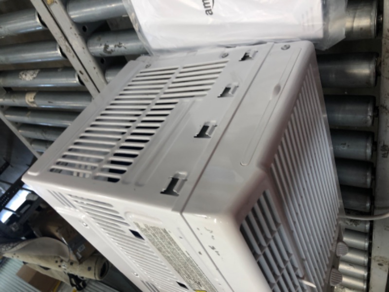 Photo 1 of Amazon Basics Window-Mounted Air Conditioner with Mechanical Control - Cools 150 Square Feet, 5000 BTU, AC Unit
