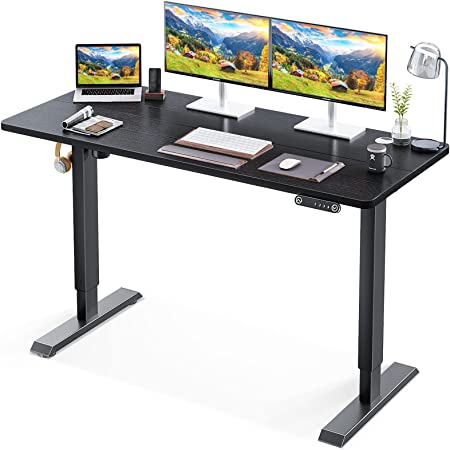 Photo 1 of KKL 55-inch Height Adjustable Electric Standing Desk, 55 x 28 Inches Stand Up Desk with Splice Board and Hook, Sit Stand Desk with Black Top and Black Frame
