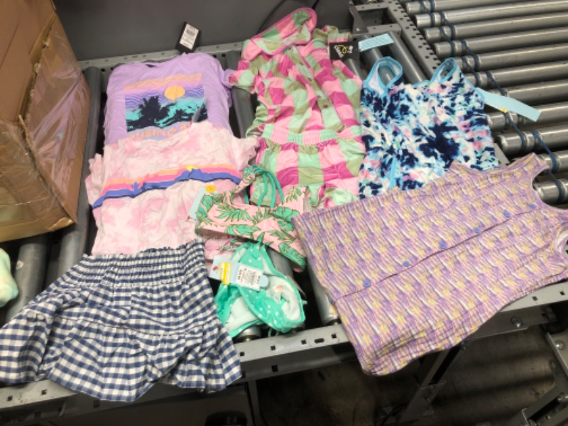 Photo 1 of **BUNDLE OF 7**
2 Blouses size 4/5
2 piece swim wear size 4/5
Skirt 4/5
2 piece pahjama 7/8
Romper and dress 7/8