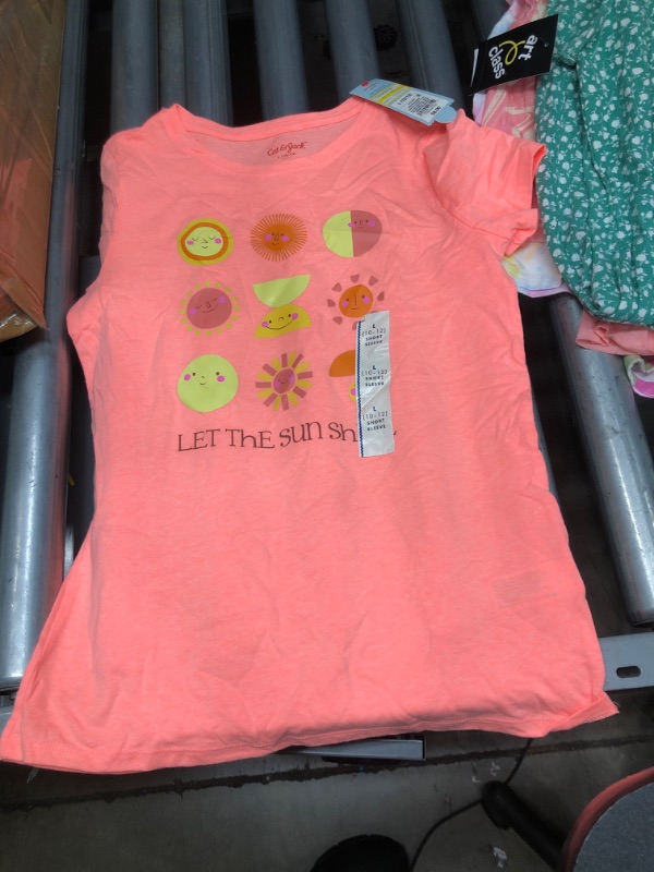 Photo 5 of **BUNDLE OF 
2 piece set pink 10/12
Shorts 14/16
2 piece Pajama 7/8
Green dress Size 18 in girls
Size 10/12 Blouse 