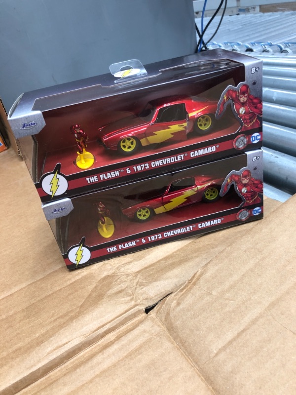 Photo 2 of **COMES WITH 2**
1973 Chevrolet Camaro Red Metallic with the Flash Diecast Figurine "DC Comics" Series "Hollywood Rides" 1/32 Diecast Model Car by Jada
