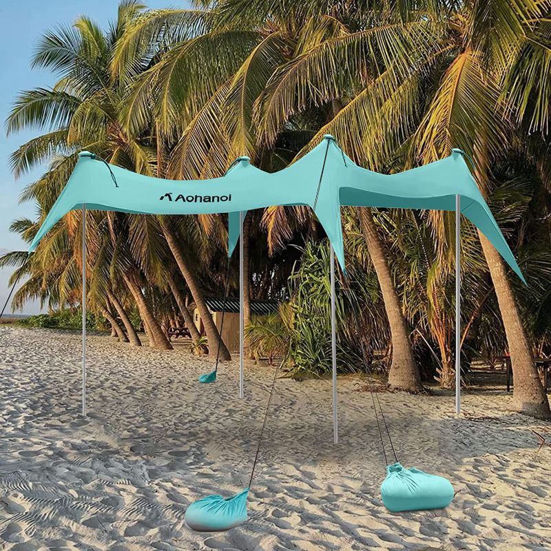 Photo 1 of Aohanoi Beach Canopy Tent Sun Shade, Beach Tent, Windproof Beach Canopy, Beach Shade (4-8 People), Stability Upgraded Beach Shelter, UPF 50+ Portable Beach Tent for Camping - 10 x 10 FT 4 Poles
