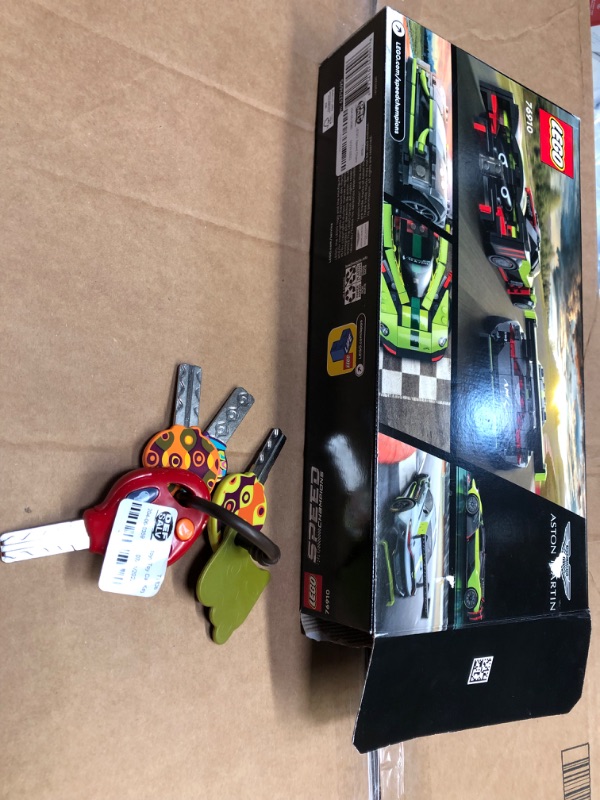 Photo 2 of BUNDLE, INCOMPLETE LEGO® Speed Champions Aston Martin Valkyrie AMR Pro and Aston Martin Vantage GT3 Building Kit, 592 Pieces
AND, BABY CAR KEY TOY
**LEGOS LOOSE AND MISSING PIECES**