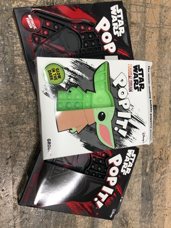 Photo 3 of Chuckle & Roar Pop It! Fidget Toy, Pack of 3 / 1(Baby Yoda - Glow in the Dark) 2(Darth Vaders)

