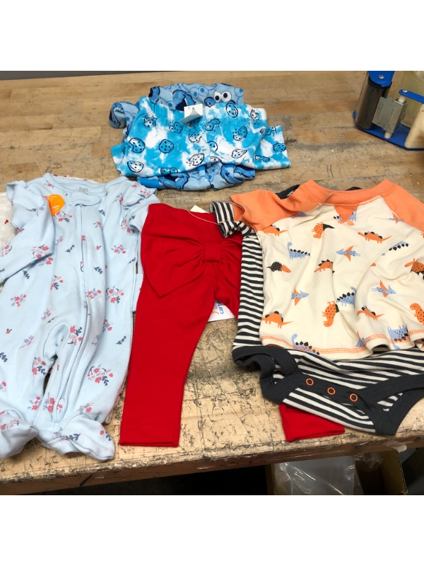 Photo 1 of BUNDLE OF GIRLS AND BOYS CLOTHS---2 GIRLS NB ONSIES, 3/6 MONTH RED GIRLS LEGGINGS, 2 BOYS 3/6 M ONSIES, PAJAMA PANTS AND SHORTS COOKIE MONSTER 6-7T