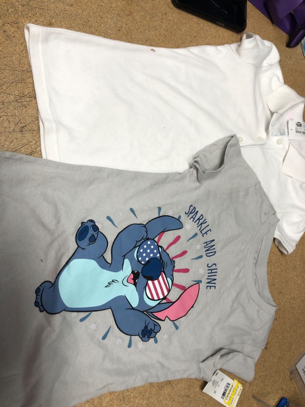Photo 1 of 2 girls shirts: size 6/7 white and grey shirts