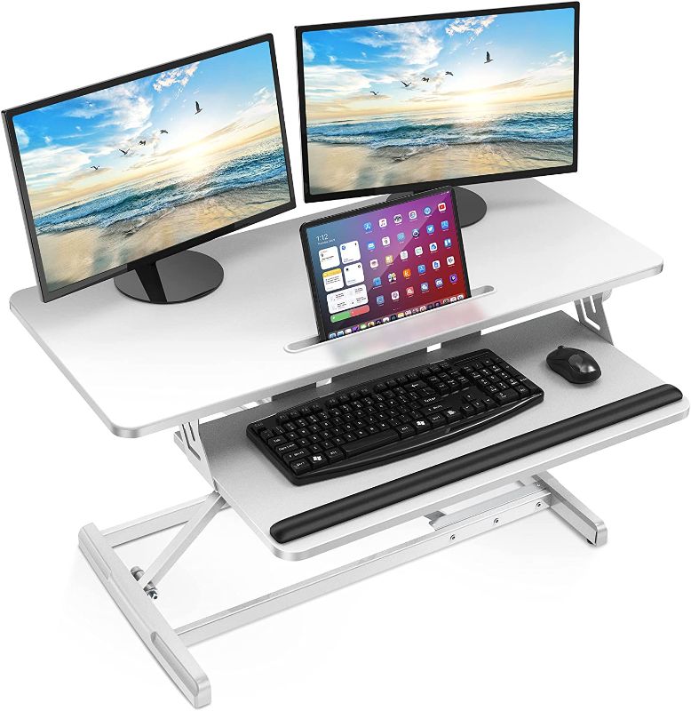 Photo 1 of AboveTEK Standing Desk Converter, 36" Stand Up Desk Riser with Gel Wrist Rest, Tabletop Sit Stand Desk Fits Dual Monitors, Two Tiered Adjustable Height Desk with Removal Keyboard Tray, Black
