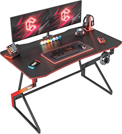 Photo 1 of CubiCubi Simple Gaming Desk Z Shaped 47 inch Gamer Workstation, Home Computer Carbon Fiber Surface Gaming Desk PC Table with Headphone Hook
