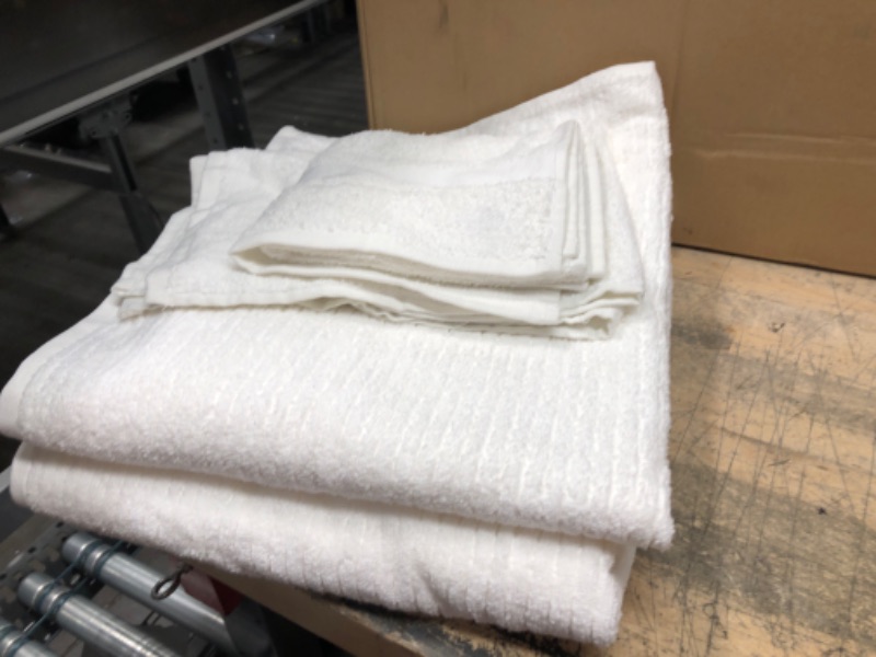 Photo 1 of 2 small 2 large white towels 