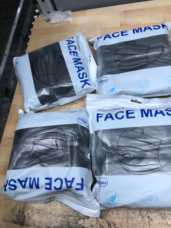 Photo 1 of 4 bags ---100Pcs Disposable Face Masks