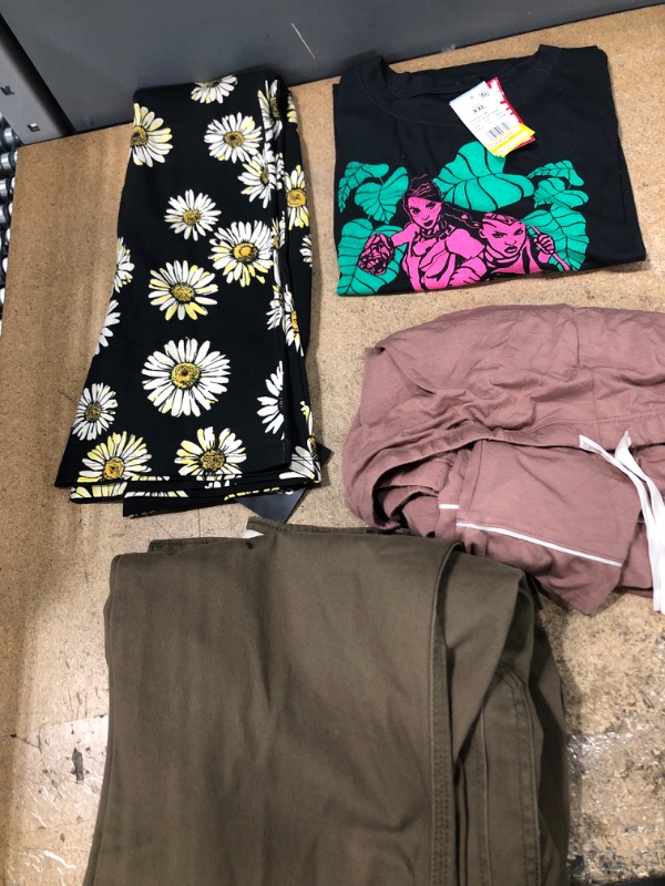 Photo 1 of  Clothing Bundle Sizes: Large-2XL *** 4 Items*** 2xl black/green/pink shirt, pink pajama pant, men pant size: A4, and flower pant for gym