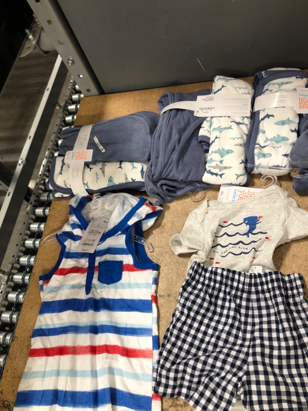 Photo 1 of Bundle bag of Baby boys' clothing ***5 item: 3 pack of Shark Hooded Bath Towel, one set of shirt and short, one jumpsuit