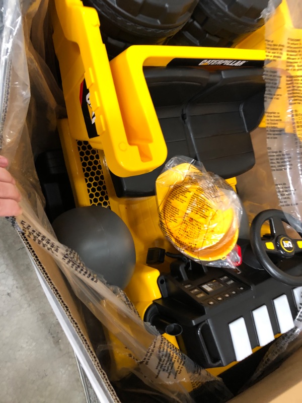 Photo 4 of 12V Cat Mining Dump Truck by Kid Trax Yellow
