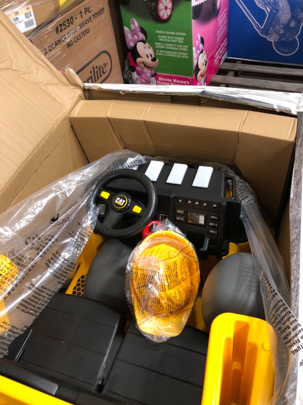 Photo 2 of 12V Cat Mining Dump Truck by Kid Trax Yellow
