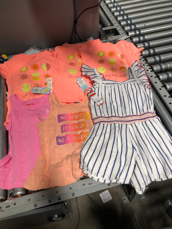 Photo 1 of **BUNDLE OF 6**
5 little girl's shirts ((SIZE 7/8)
1 Little girl's romper (SIZE 7/8)