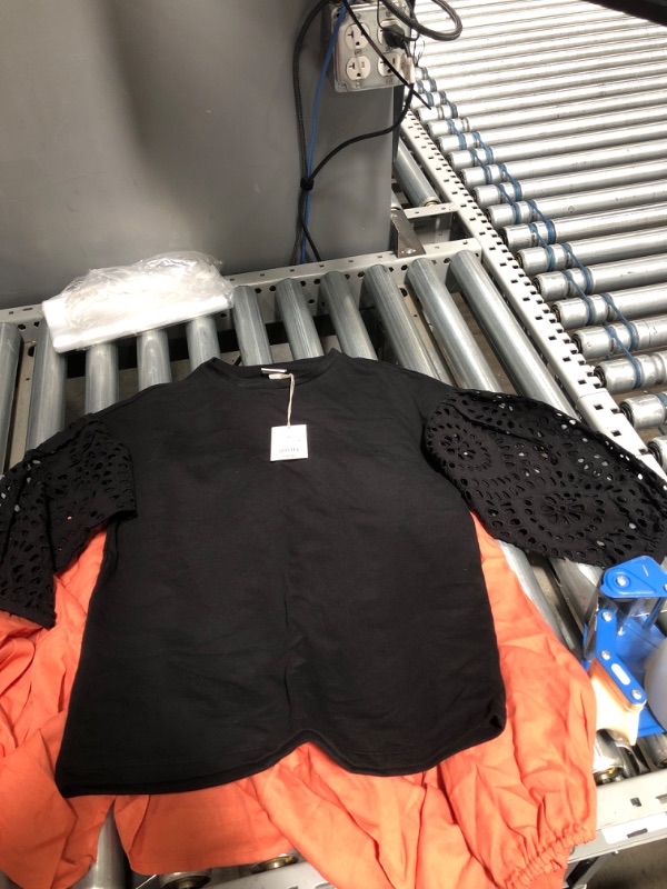 Photo 1 of **BUNDLE OF 2*
2 women's blouses (Black size S, Orange size L)