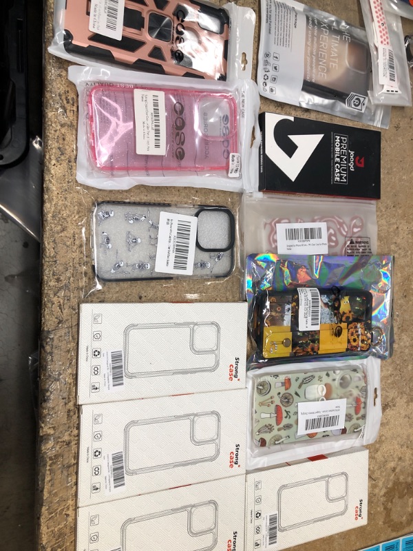 Photo 1 of MISCELLANEOUS BUNDLE OF ASSORTED PHONE CASES AND APPLE BAND AND OTHER ELECTRICAL GOODS