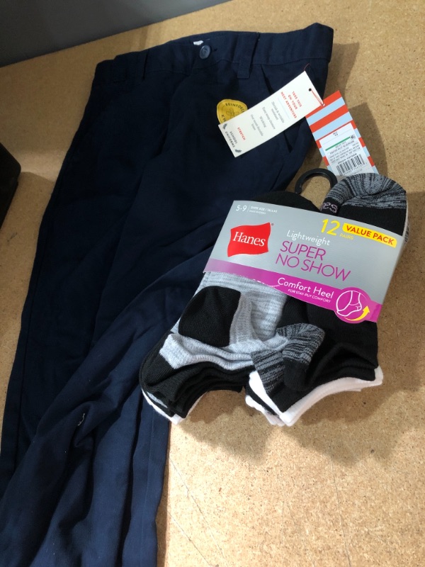 Photo 1 of 2 Items Clothing Bundle (Boys 10 pants; size 5-9 socks comfort heel) 
