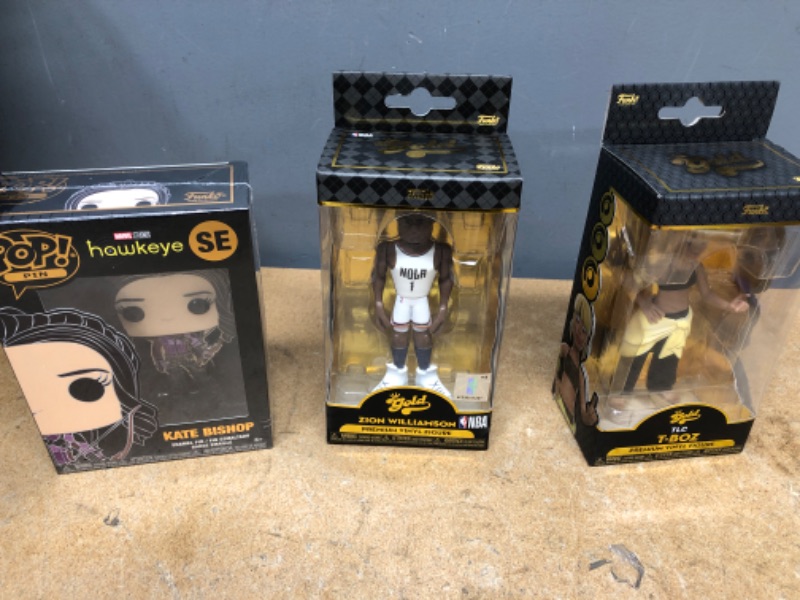 Photo 1 of -Funko Vinyl Gold 5": TLC - T-Boz
-Gold 5" NBA: Pelicans - Zion Williamson with Chase
-Funko Pop Pin Marvel Kate Bishop SE NEW SEALED ENAMAL GLOW in DARK HAWKEYE GID