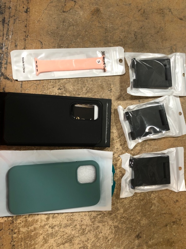 Photo 1 of bundle of 6 electronic accessories
green iPhone 12 case, black galaxy case, phone holders and apple watch strap 
 