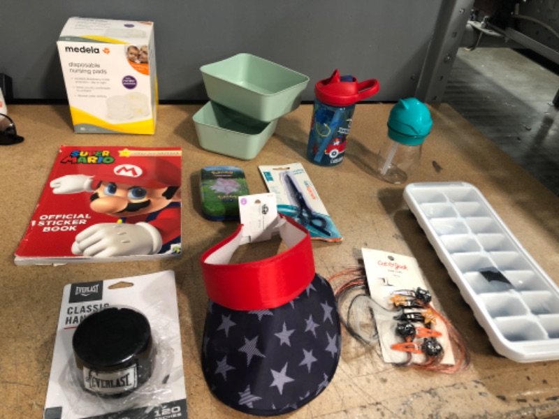 Photo 1 of BUNDLE OF: NURSING PADS 60PACK, EVERLAST HAND WRAPS, 4TH OF JULY VISOR HAT, LITTLE GIRLS 5PCS HALLOWEEN HAIR CLIPS, ICE CUBE TRAY, HAIR STYLING SCISSORS, (X2) TODDLER CUPS, 2PACK SMALL MINT GREEN STORAGE TRAY, KIDS POKEMON TRADING CARDS, MARIO STICKER BOO