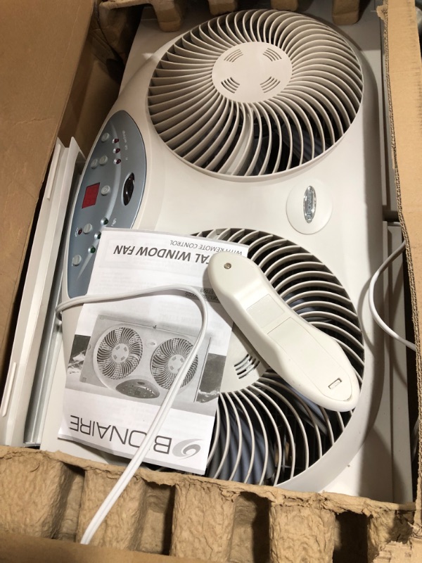 Photo 2 of Bionaire Window Fan with Twin 8.5-Inch Reversible Airflow Blades and Remote Control, White
