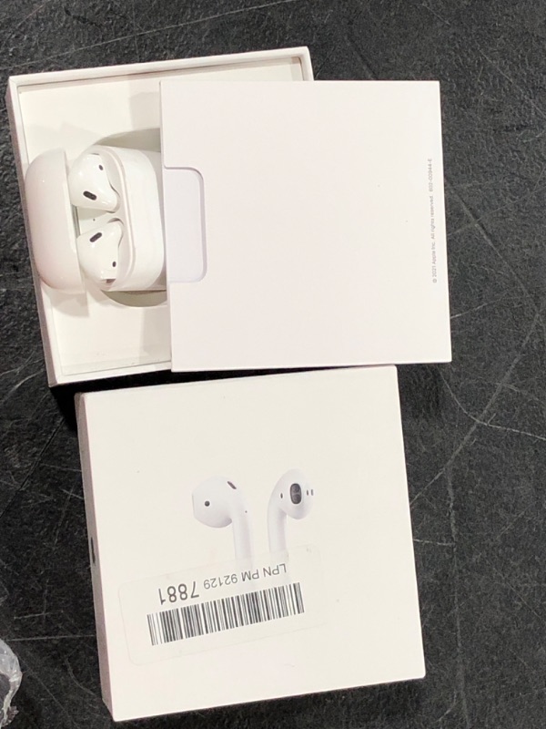 Photo 2 of Apple AirPods with Charging Case (Latest Model)