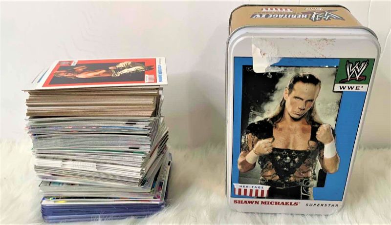 Photo 1 of STACK OF COLLECTIBLE WRESTLING CARDS AND TIN