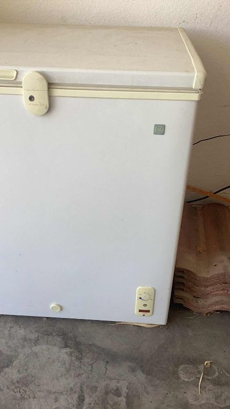 Photo 2 of GENERAL ELECTRIC STAND UP FREEZER 38” X 21” H 32”. FOOD NOT INCLUDED