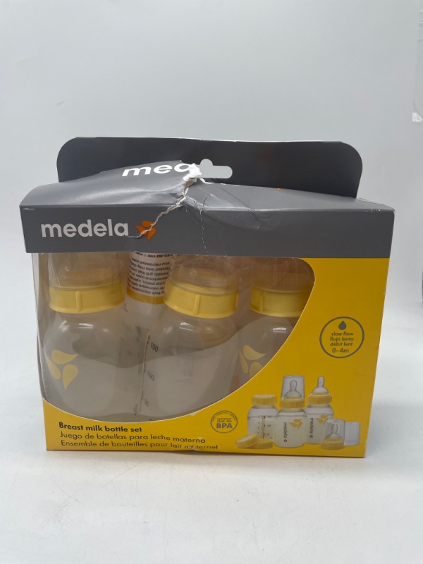 Photo 2 of Medela Breast Milk Storage Bottles, 3 Pack of 5 Ounce Breastfeeding Bottles with Slow Flow Nipples, Lids, Wide Base Collars, and Travel Caps, Made Without BPA 3 Count (Pack of 1)