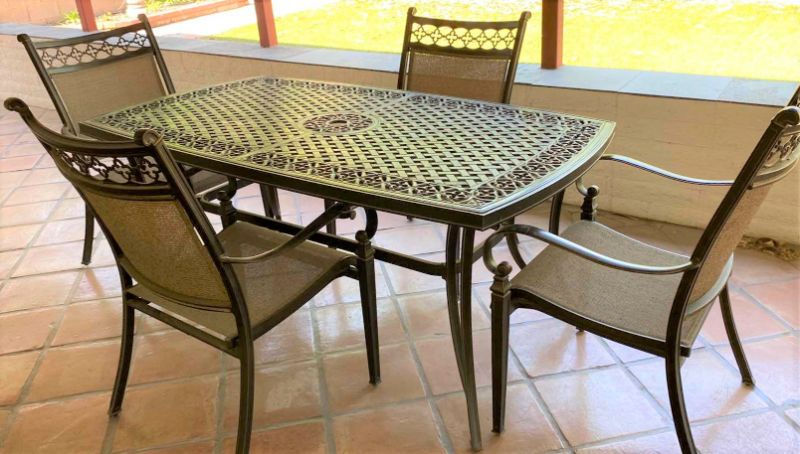 Photo 1 of ALUMINUM PATIO TABLE 67” X 38” H29” WITH 4 CHAIRS