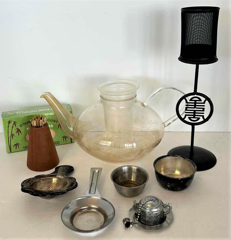 Photo 1 of  TEA ASSORTMENT - GLASS TEA POT, TEA COZIES AND ACCESSORIES 