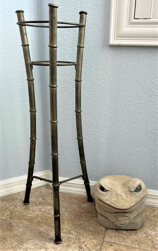 Photo 1 of OUTDOOR DECOR 2  PIECE - METAL BAMBOO PLANT STAND  H 28”AND HEAVY CERAMIC FROG  W SIGNATURE RANKIN