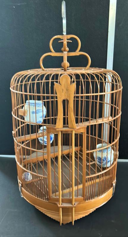 Photo 1 of ANTIQUE CHINESE WOVEN HANDMADE BIRDCAGE WITH PORCELAIN POTTERY FEEDERS 14” x 23”