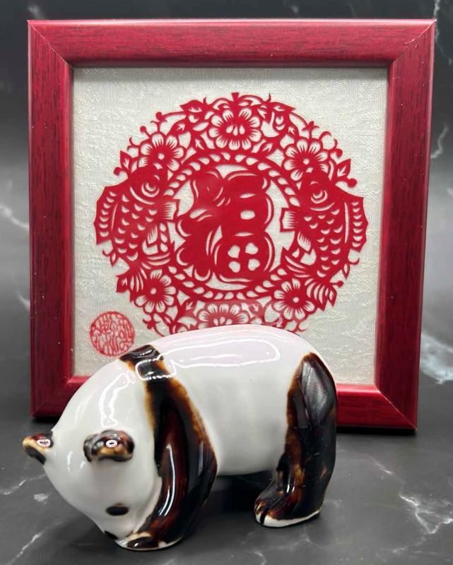 Photo 1 of 2- CHINESE COLLECTIBLES- STAMPED NUMBERED PORCELAIN PANDA BEAR. FRAMED SILK FABRIC W SILK THREADS (panda bear is 3 1/2” x 2”)