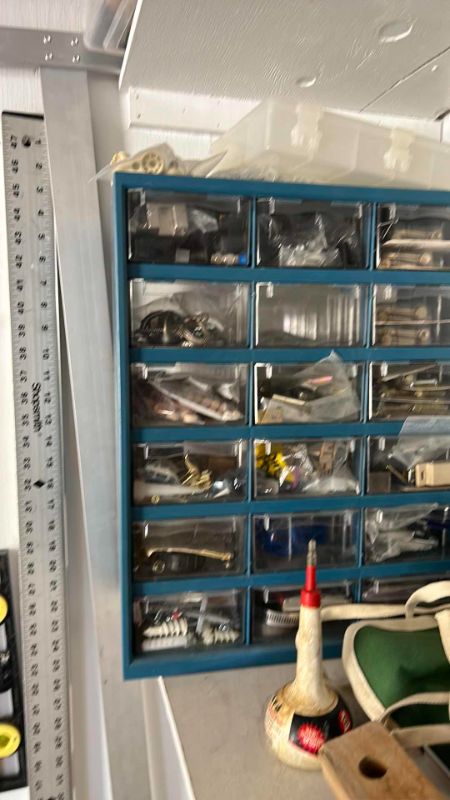 Photo 1 of CONTENTS OF CABINET IN GARAGE