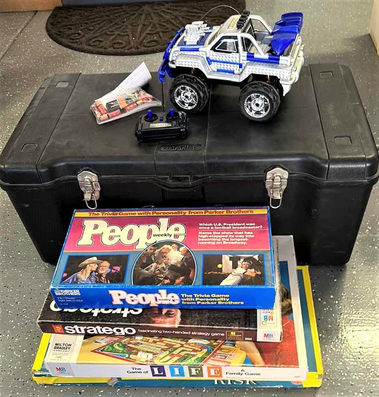Photo 1 of LARGE BLACK TOTE WITH GAMES AND RC TRUCK