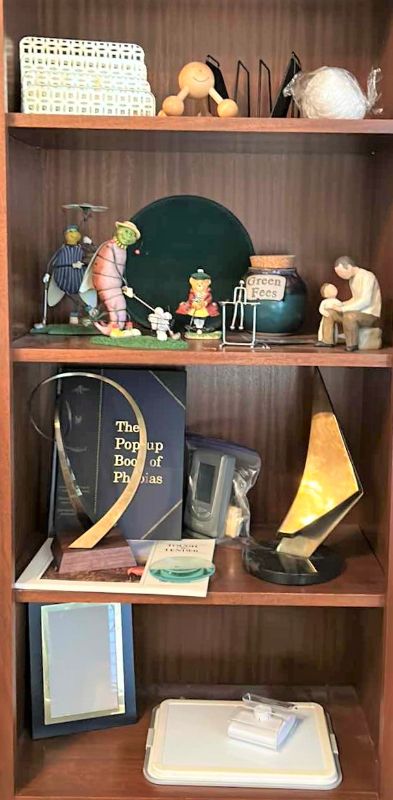 Photo 1 of CONTENTS OF BOOKSHELVES - HOME DECOR - METAL SCULPTURES , GOLF FIGURINES AND MORE