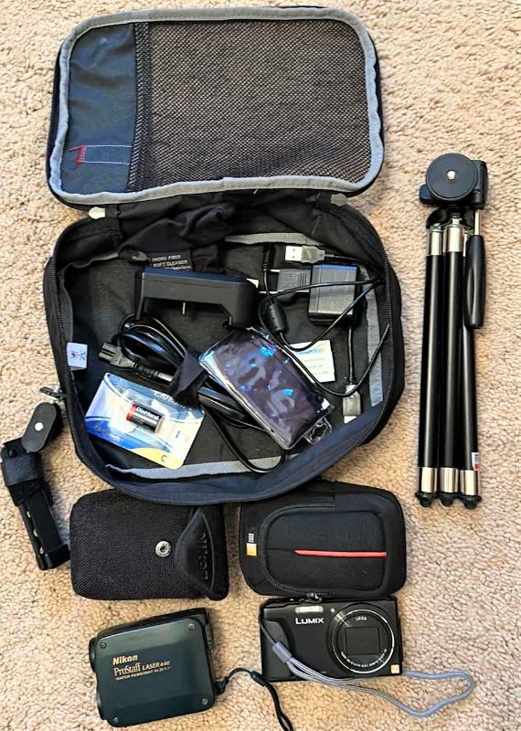 Photo 1 of Lumix camera, Nikon, Prostaff, laser carrying case, tripod, and accessories