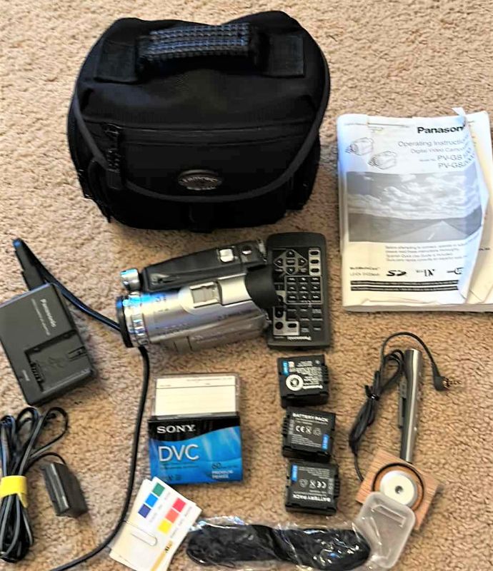 Photo 1 of Panasonic digital video camcorder with accessories and carrying case