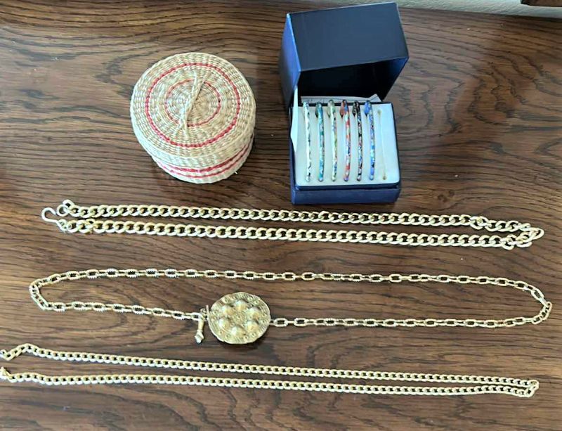 Photo 1 of Three gold chain belts, a collection of bracelets and wicker basket