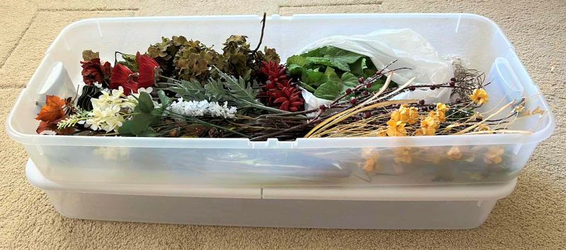 Photo 1 of 2 - under the bed storage totes, one with floral pieces