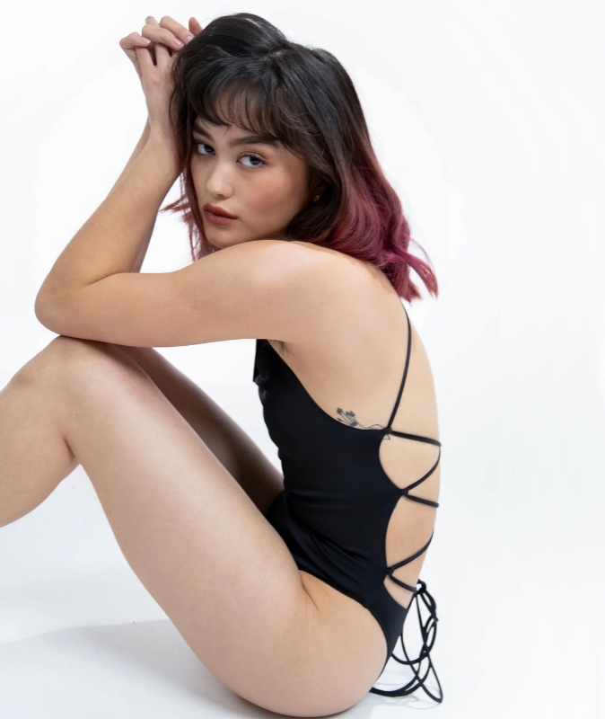 Photo 1 of SIZE XS NAHLA (BLACK)- The Nahla bodysuit features a round neckline, strappy back to give you an edgy touch, and a high cut to elongate your legs. It's guaranteed to rise and hug you in all the right places. It also features an ultra-soft cotton lining fo
